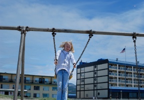 Johanna on a swing at the Seaside beach