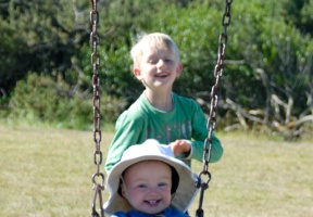 Elsa giggling as Tuomas gives her a push