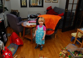 Elsa waiting for the cake after having spaghetti for dinner