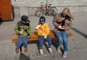 The boys eating "French dogs" - hot dogs in a baguette