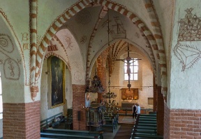 Looking towards the altar from the organ loft. The original artwork in the church was added by the builders of the church who weren't necessarily trained in art, and the end result is rather interesting.